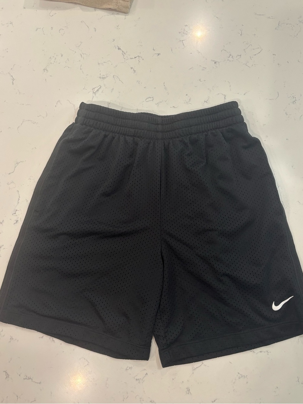 Boys dri-fit, black athletic mesh shorts with logo